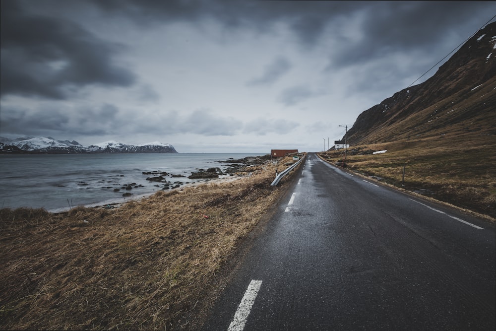 road beside body of water