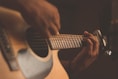 person playing guitar