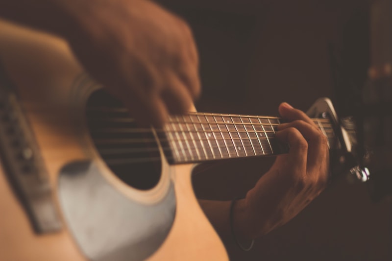 Guitarist practicing with acoustic guitar