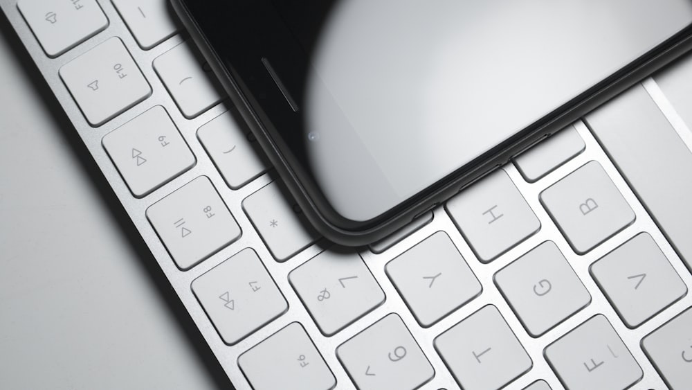 a close up of a computer keyboard with a mouse