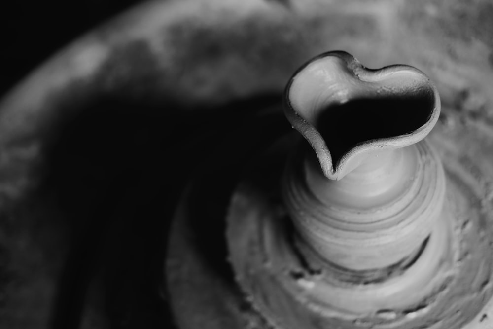 selective focus and grayscale photo of clay pot