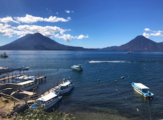 The serene waters of Lake Nicaragua reflecting the early morning mist and volcano silhouettes.