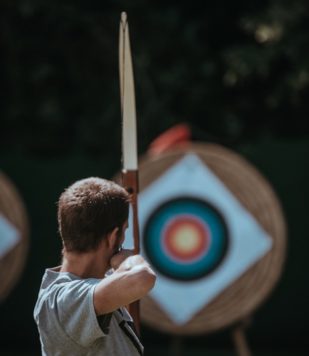 white and brown composite bow