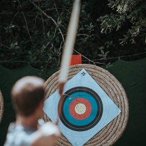 selective focus photography of arrow target
