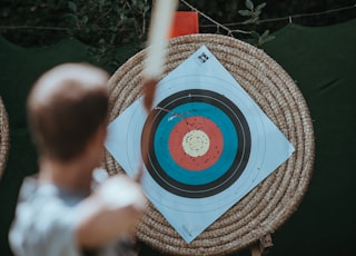 selective focus photography of arrow target