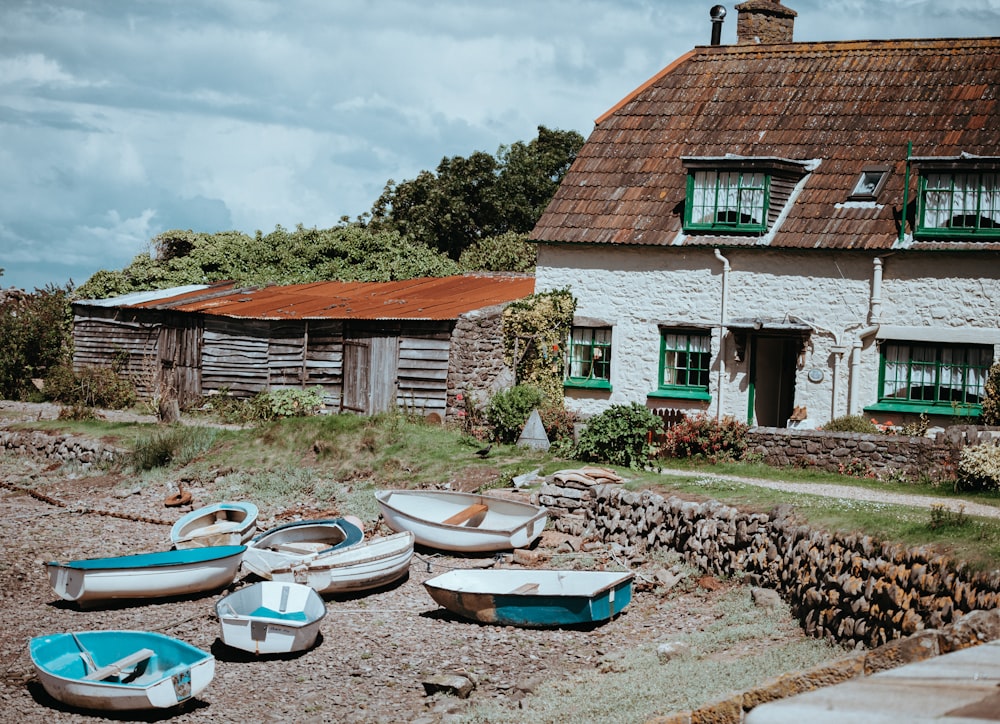 white row boats on shore