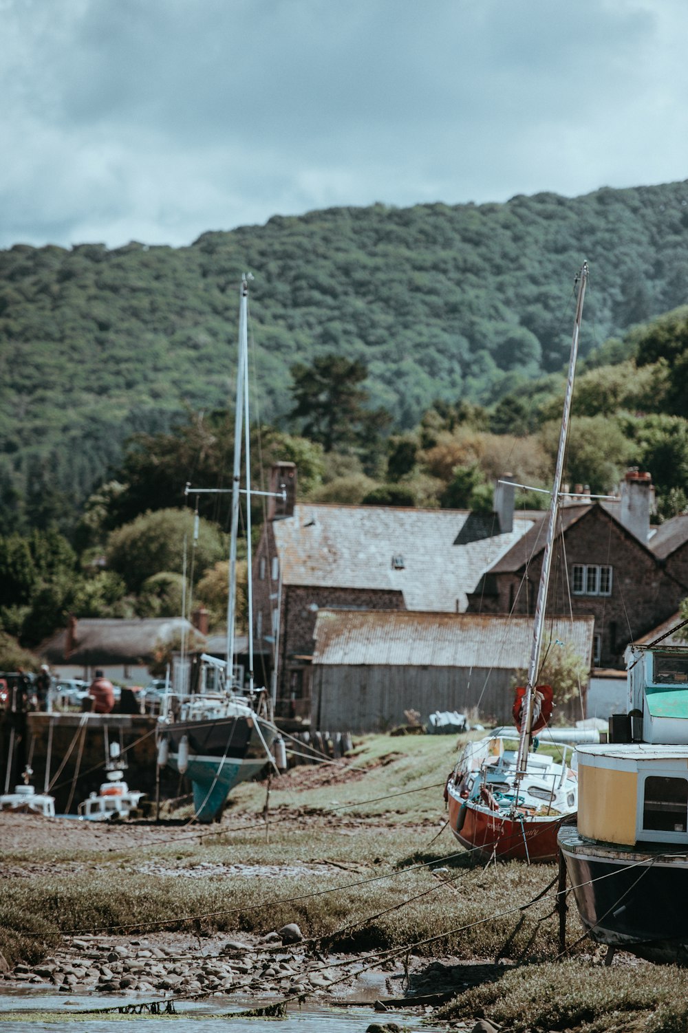 black and red boat near body of water background of mountain view