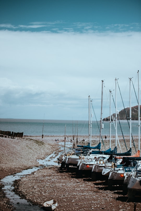 white boats on land in Porlock Weir United Kingdom