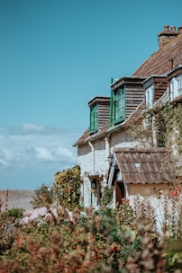 A charming cottage surrounded by greenery.
