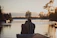 Couple enjoying a serene sunset on the private dock overlooking calm waters.
