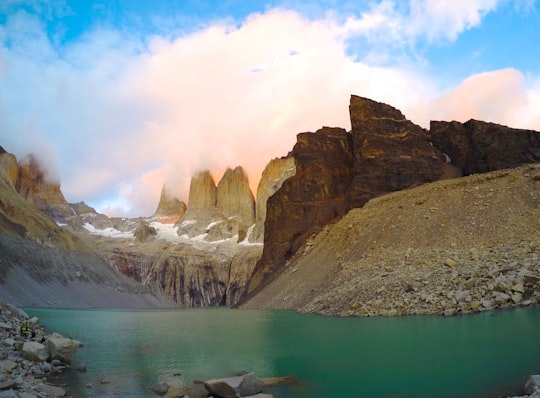 rocky mountain with body of water in Torres del Paine National Park Chile