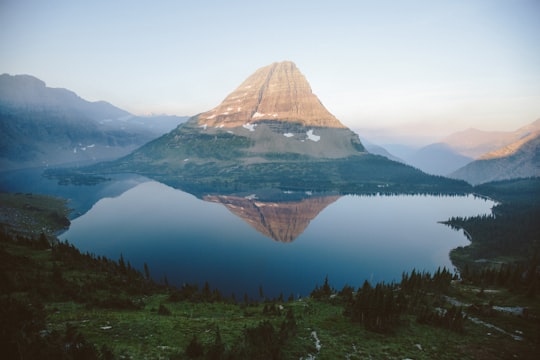 aerial view of lake near mountains in Glacier National Park United States