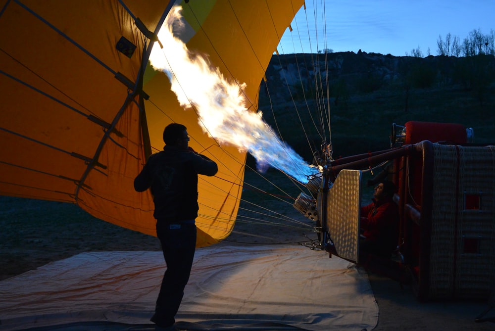 man in front of hot air balloon