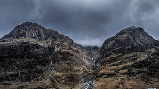 mountains under cloudy sky during daytime in Glen Coe United Kingdom