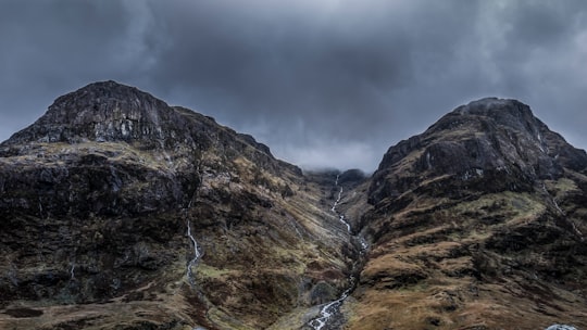 mountains under cloudy sky during daytime in Highland United Kingdom