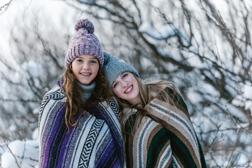 Volunteers distributing blankets in a winter setting.