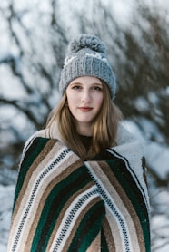 selective focus photography of woman with poncho
