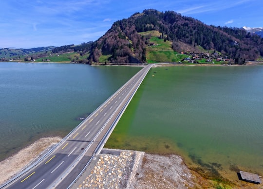 bridge during daytime in Sihlsee Switzerland
