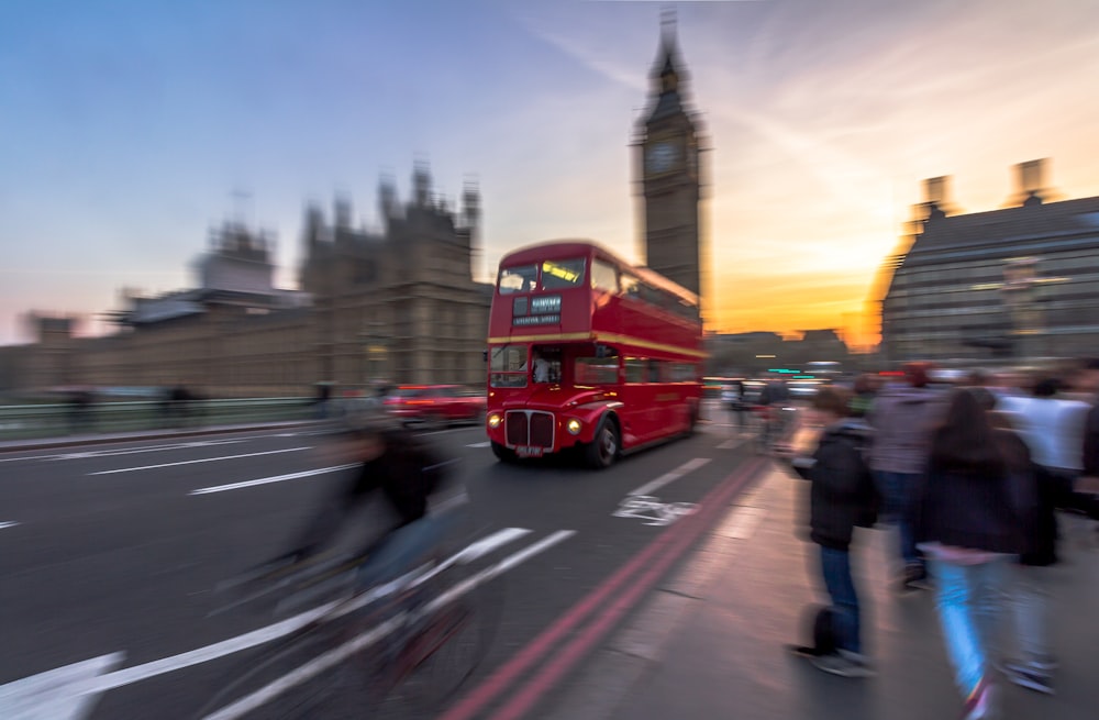 tilt shift double decker bus traveling on road