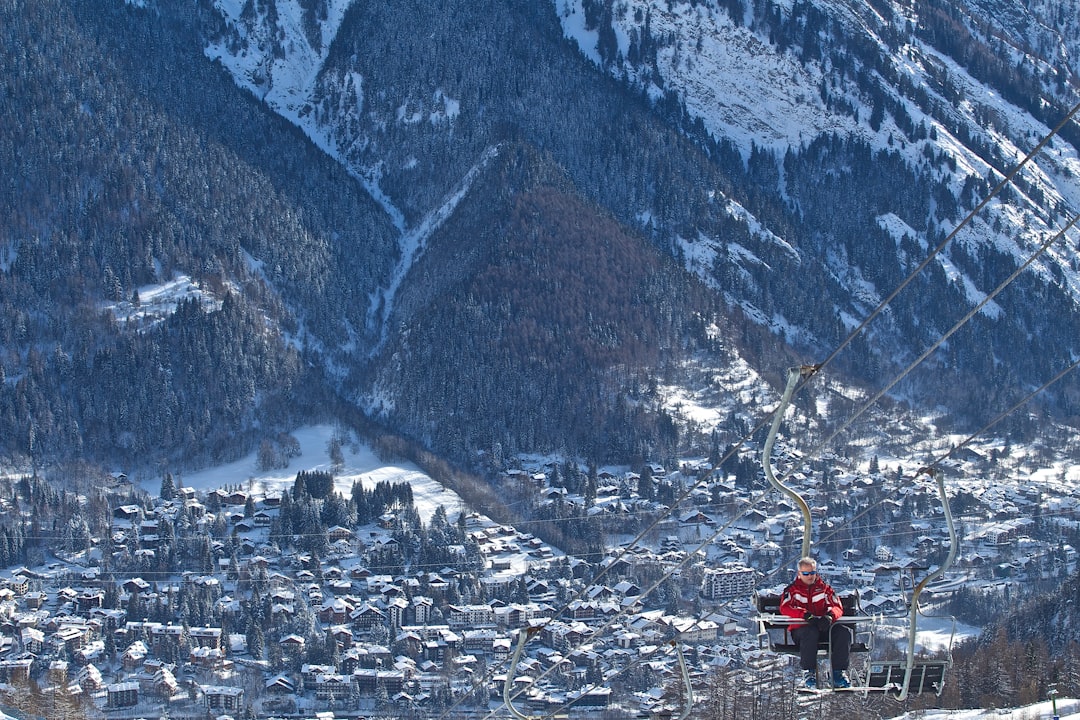 man riding on cable car