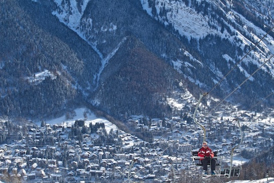 man riding on cable car in Courmayeur Italy