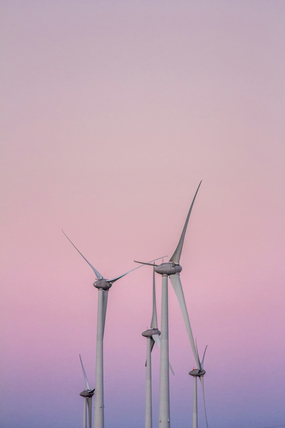 low angle photography of wind turbines