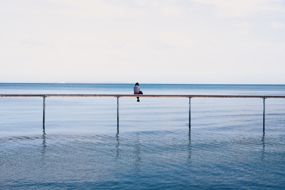 person sitting down on frame