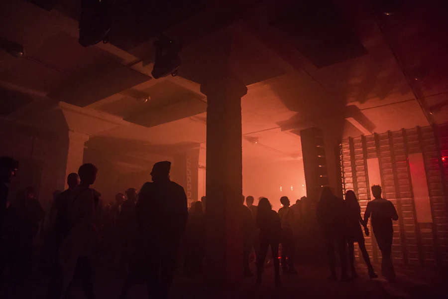 A crowd inside a dim room