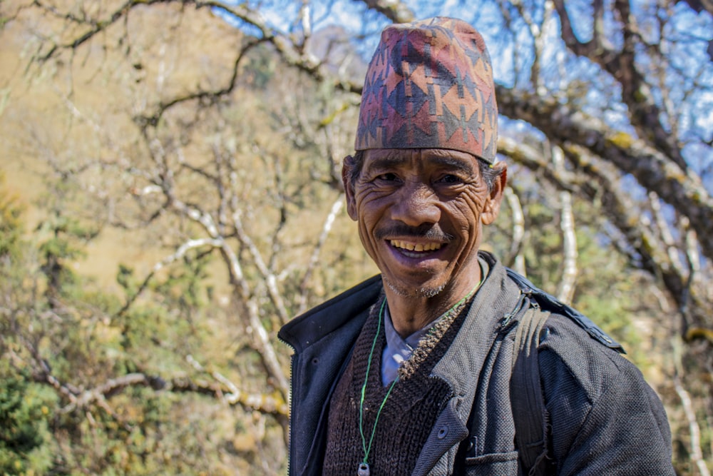 a man wearing a hat and a jacket