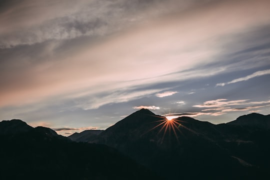 silhouette of mountain under white sky in Manghen Pass Italy