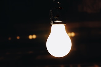Warm incandescent lamps glowing softly in a cozy room.