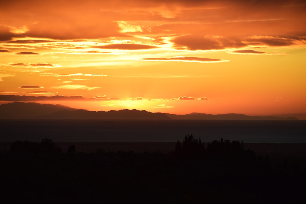 brown mountain silhouette during sunset