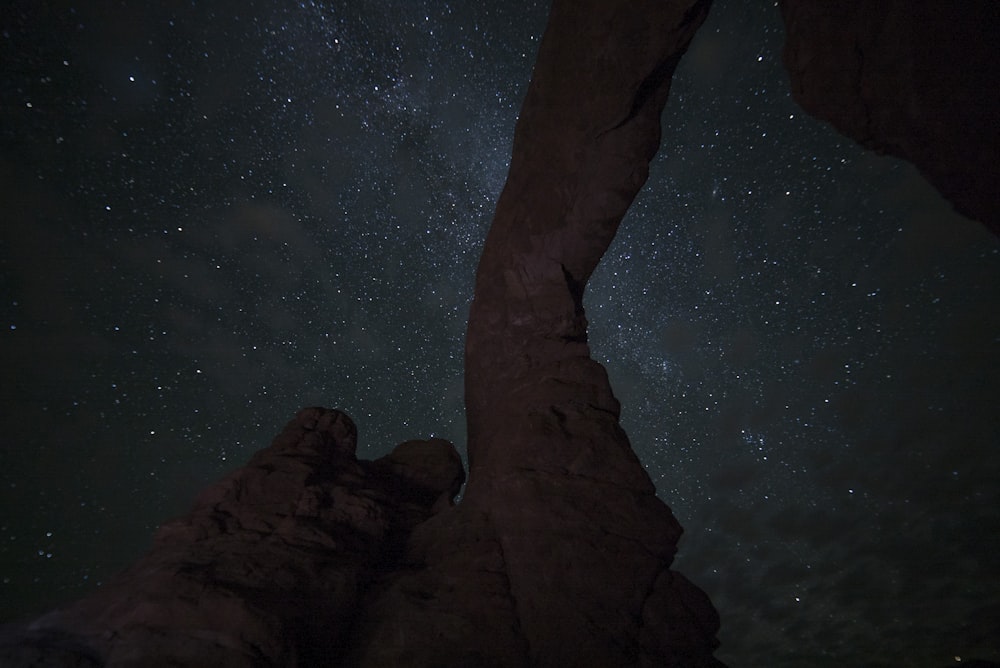 milky way behind rock formation