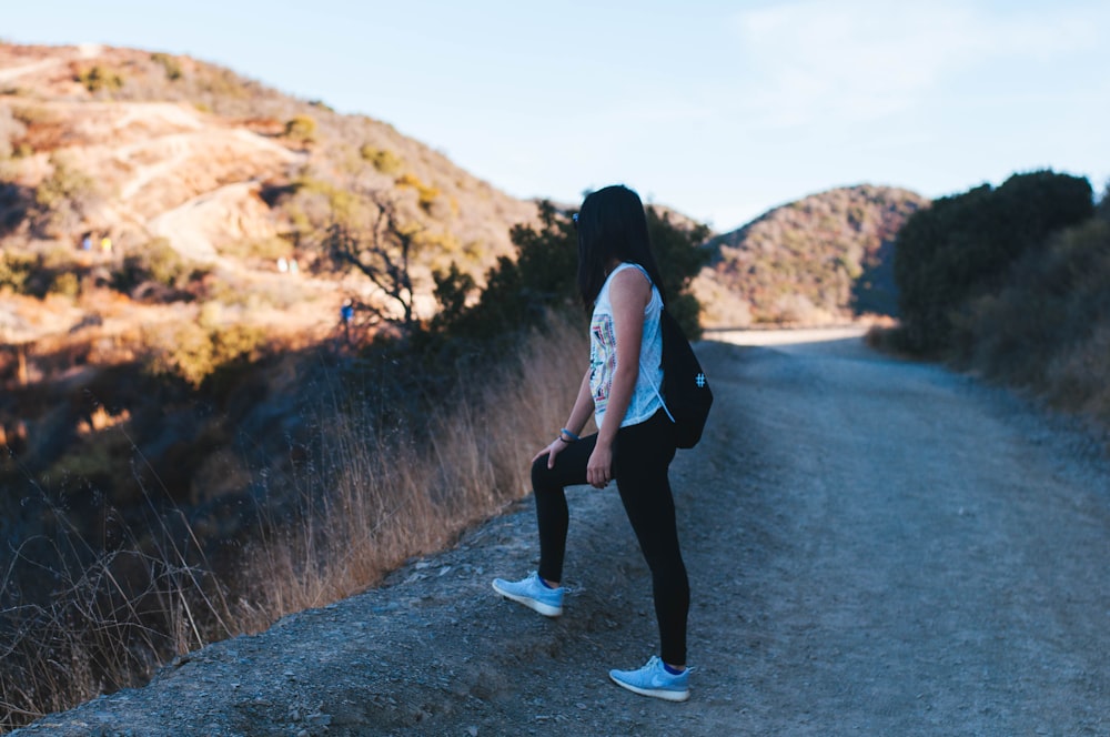 woman wearing black leggings standing