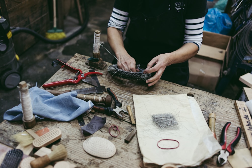 person holding a black bowl