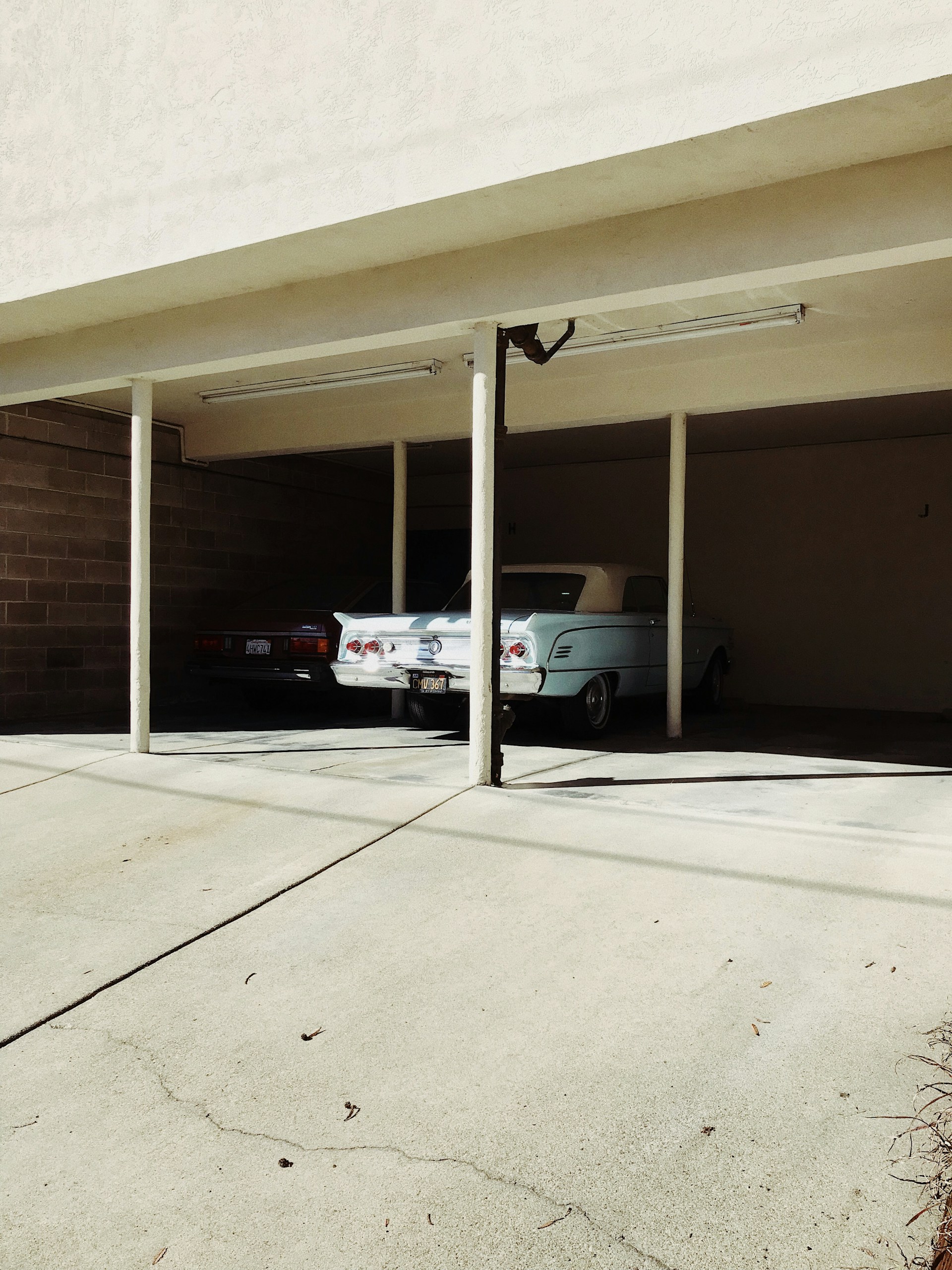 white coupe parked