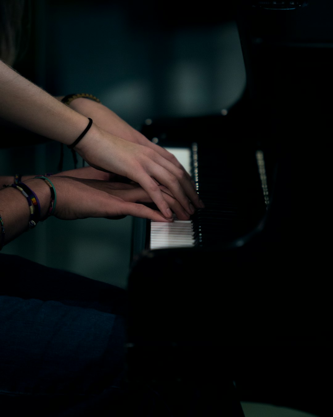 two person playing piano