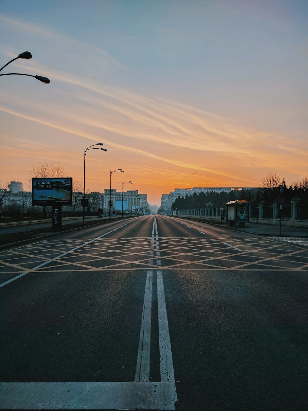 lamp post on gray concrete road