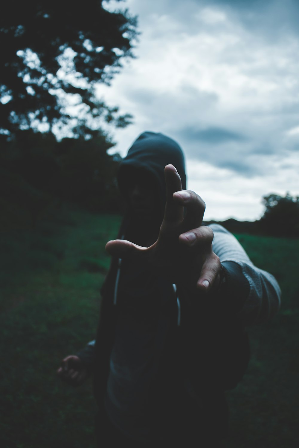 selective focus photography of man wearing hoodie