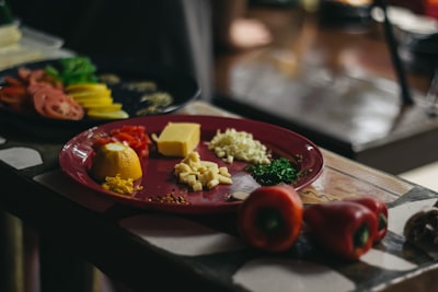 sliced food on round red ceramic plate taste teams background