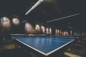 selective focus of blue ping-pong table