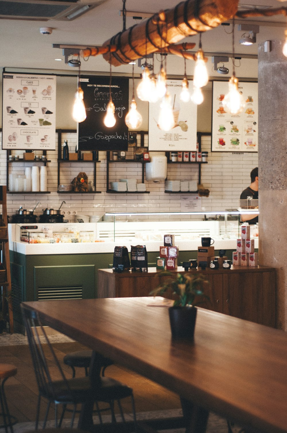 person taking picture inside of restaurant