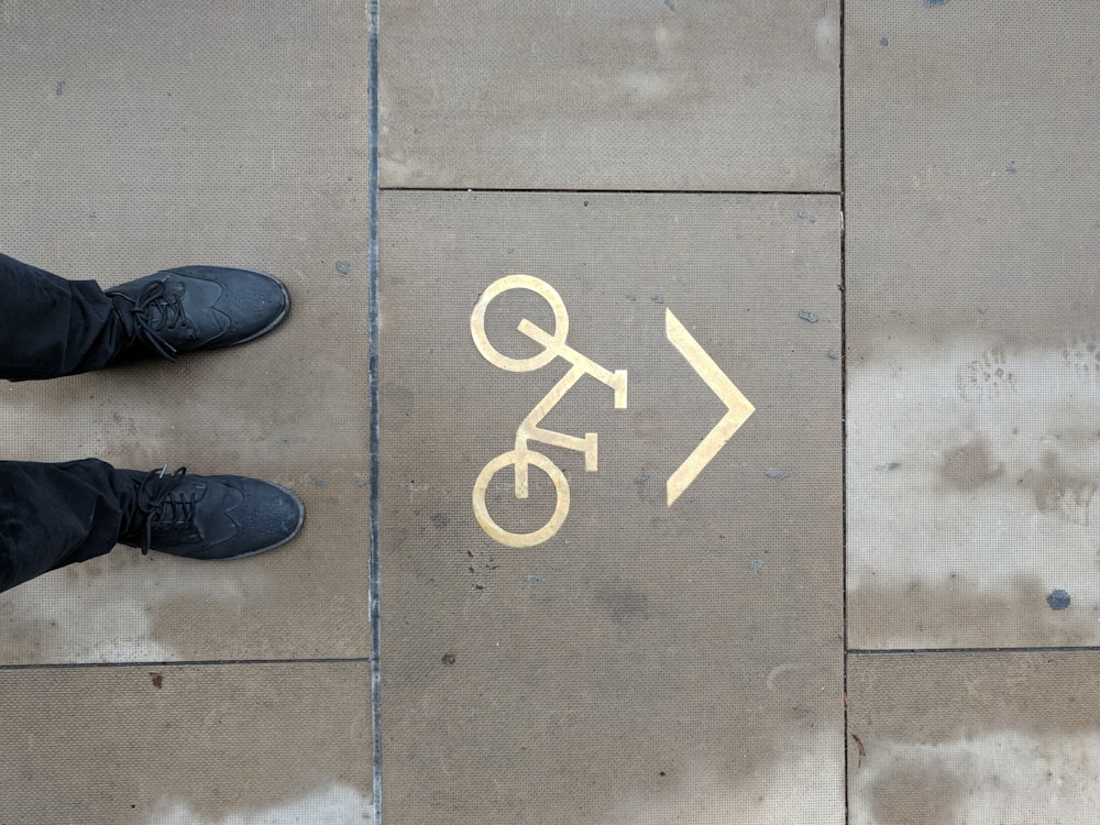 person standing on bicycle parking area