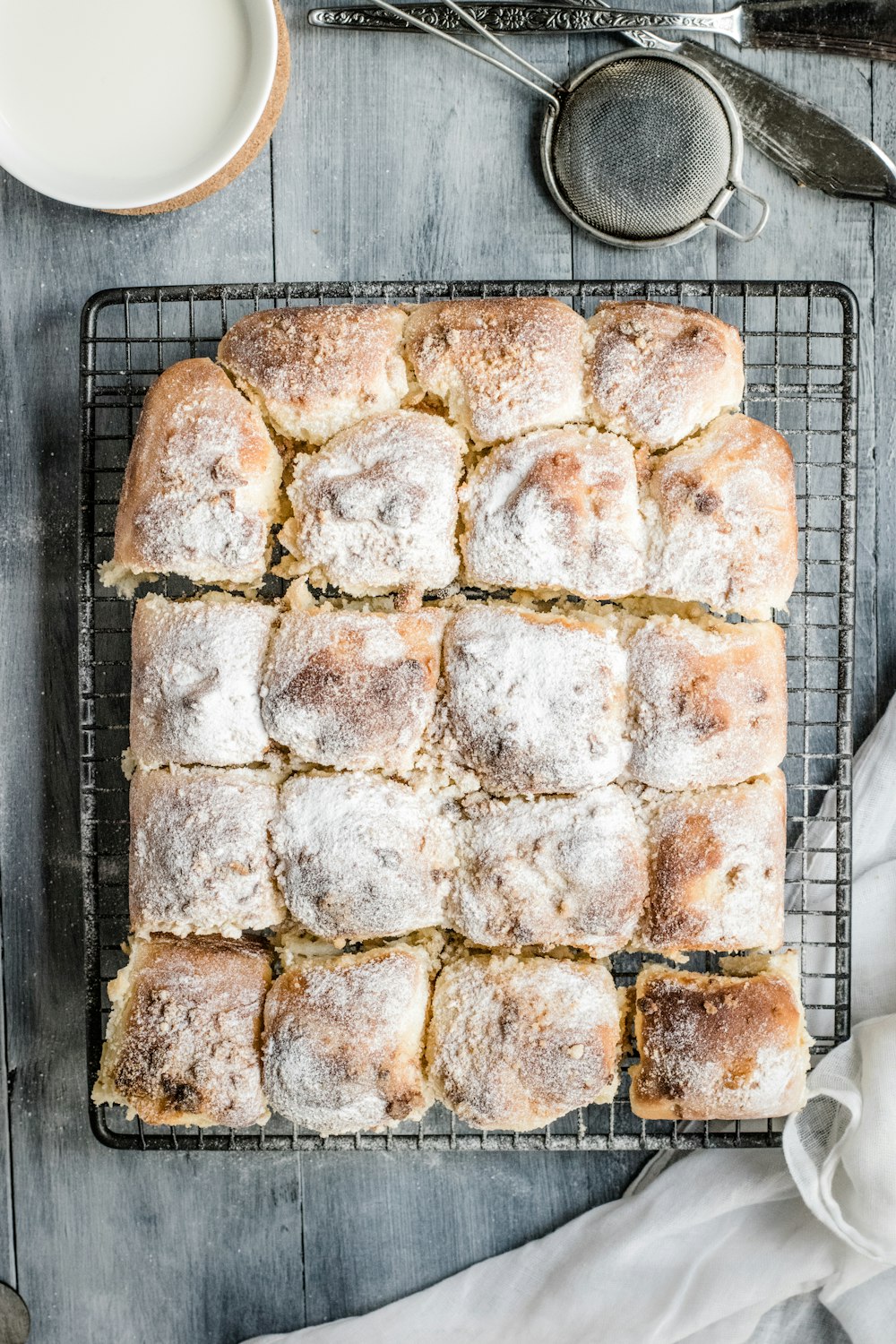 baked bread on gray mesh baking tray