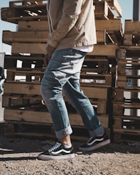 person standing beside pallet