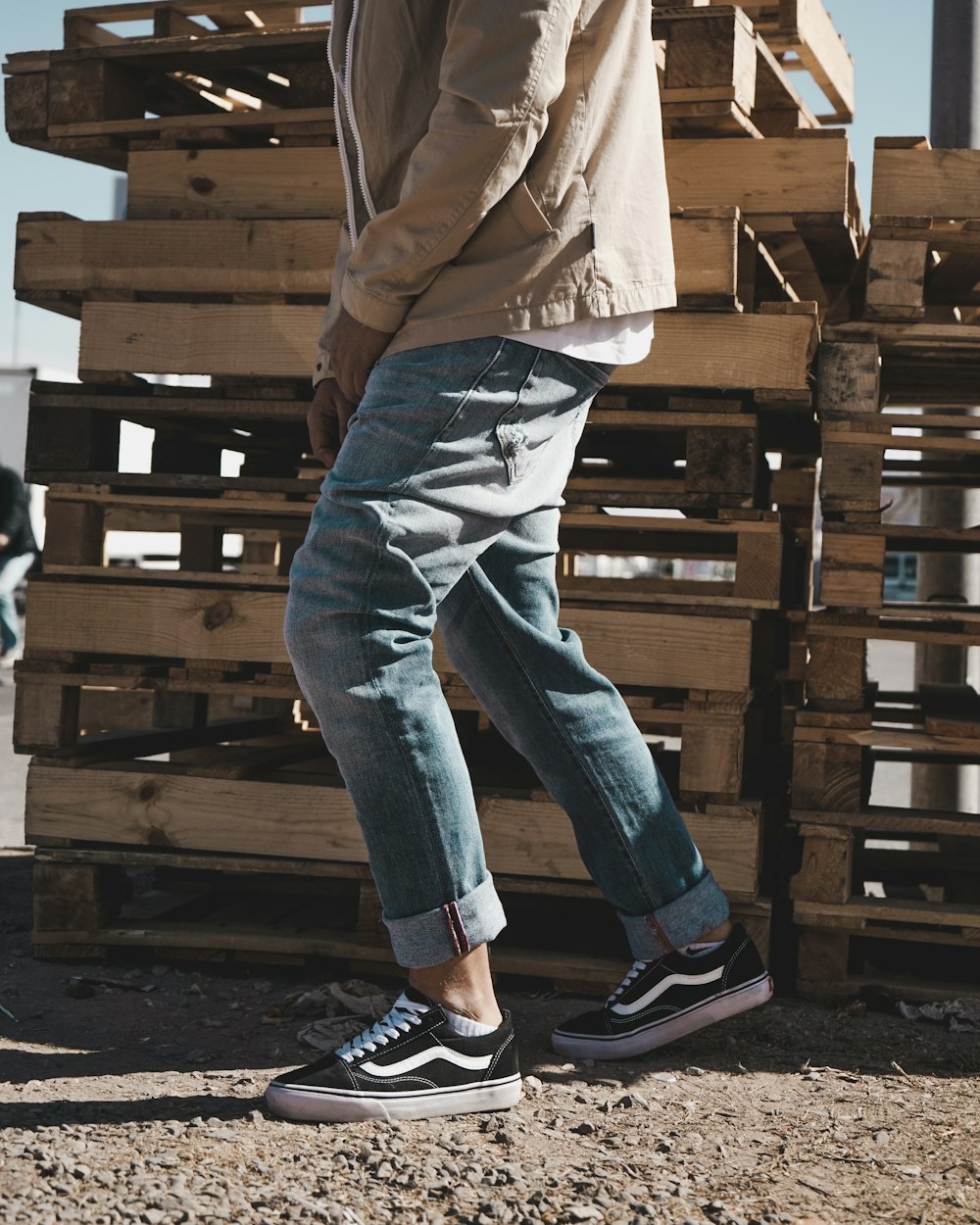 person standing beside pallet