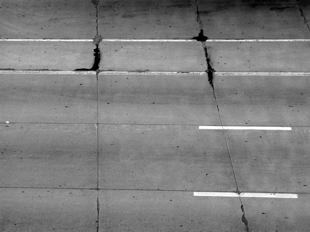 a black and white photo of an overhead view of a street