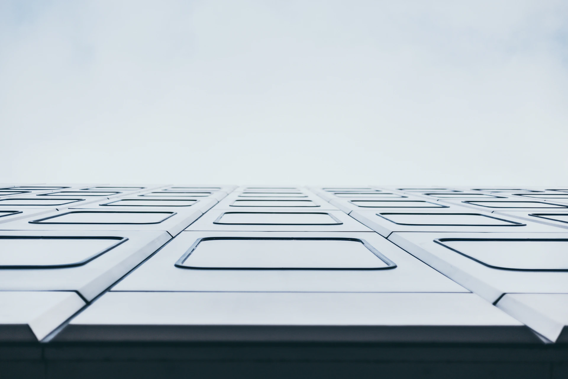 a close up of a building with a sky background