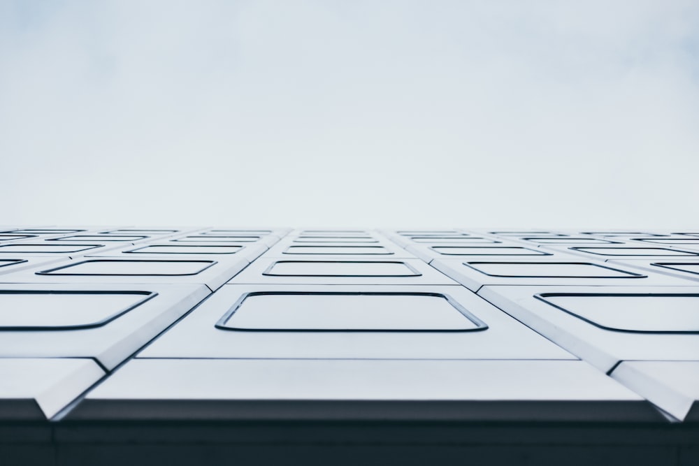 a close up of a building with a sky background