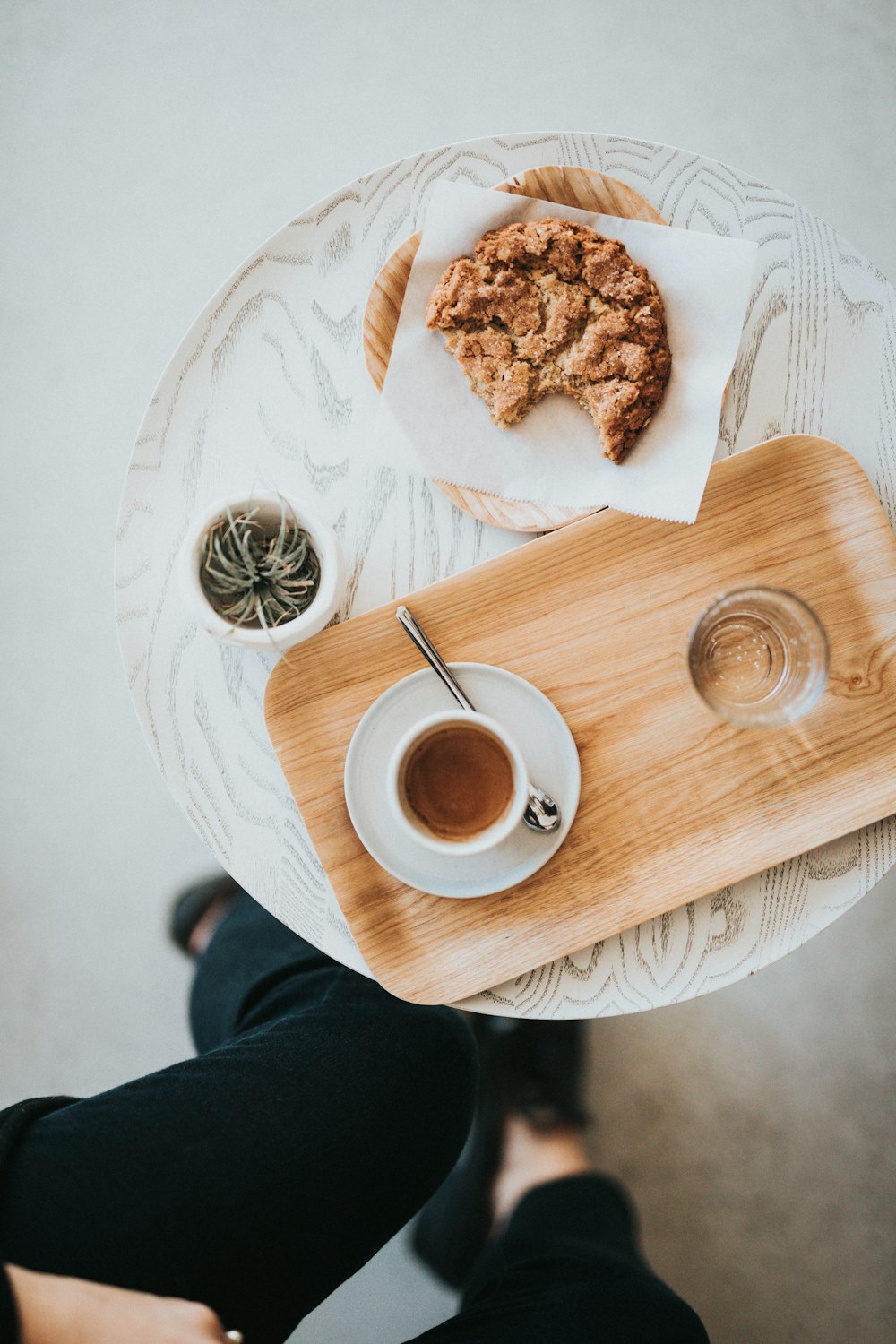 flat-lay photography of pastry and liquid-filled cup on tray